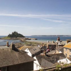 Rooftop view over Marazion from Back Lane showing St Michael's Mount and the Town Hall